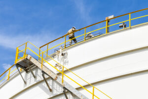 technician-scanning-tank-roof-with-ultrasonic-scanner